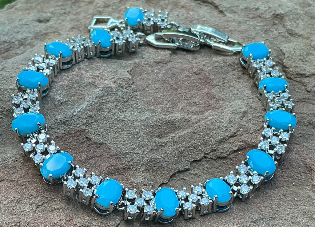 Turquoise Blue Oval Cut Link Tennis Bracelet with Cubic Zirconia