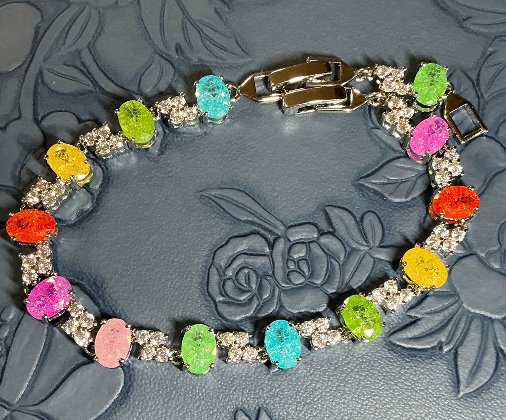 Oval Candy-colored translucent stones with sparkling shimmer throughout, accented by cubic zirconia stones.
