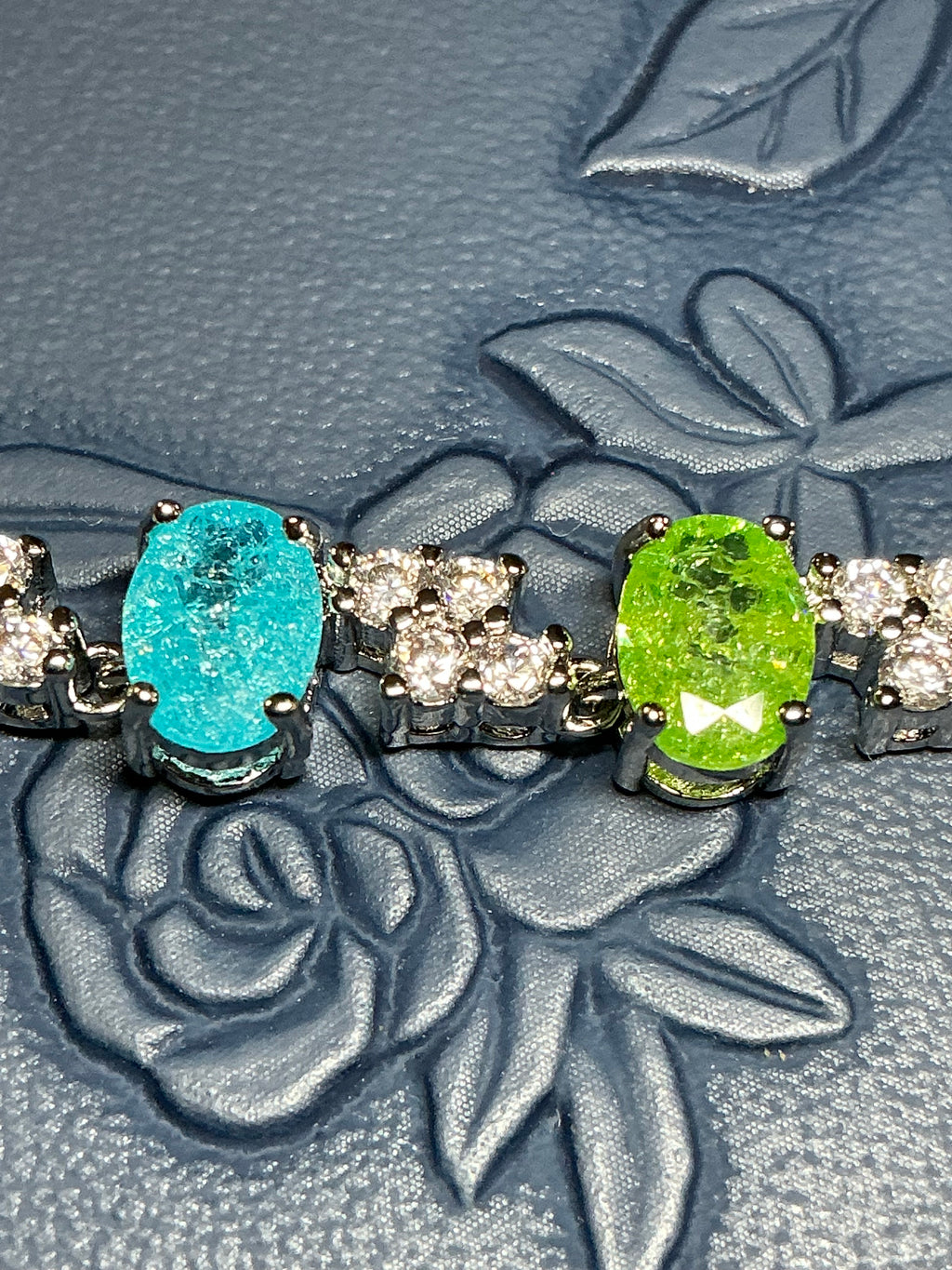 Oval Candy-colored translucent stones with sparkling shimmer throughout, accented by cubic zirconia stones.