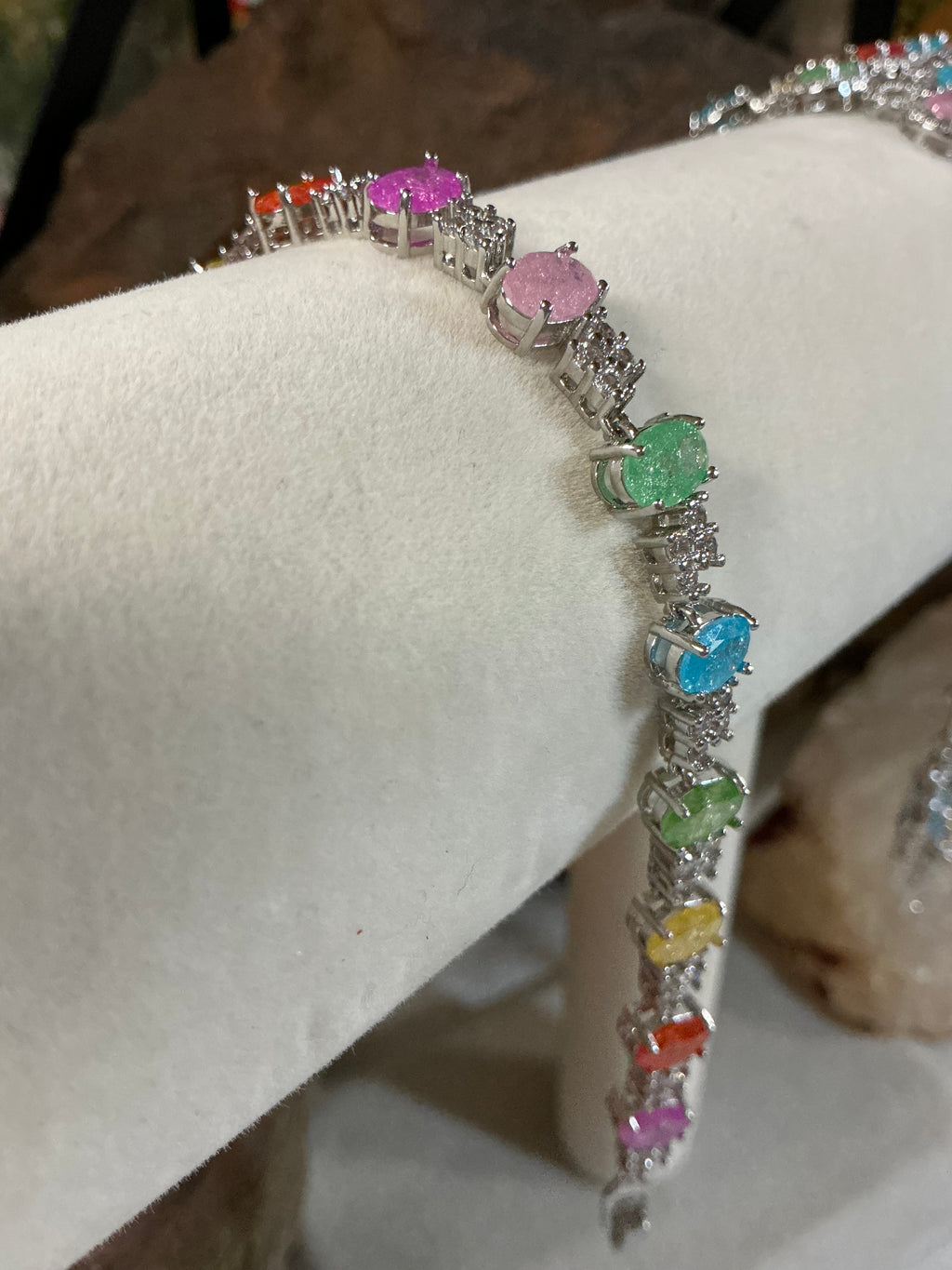Oval Candy-colored translucent stones with sparkling shimmer throughout, accented by cubic zirconia stones.